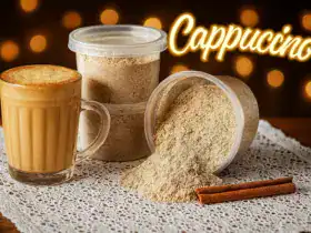 Mistura de cappuccino caseiro em pote e xícara com leite cremoso e canela em pó